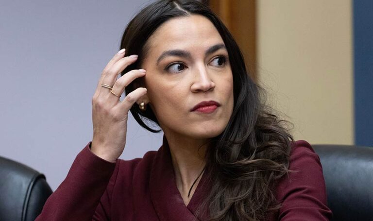 AOC held hands with Joe Biden one time, now sexists are calling her a sell-out